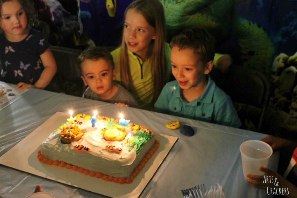 Aquarium Cake and Fish Cupcakes Lit Candles