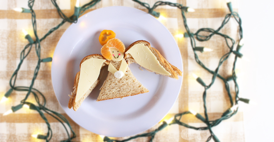 This Angel Sandwich Christmas lunch idea for kids is perfect for school lunch or lunch at home over winter break | shaped sandwich | angel shaped sandwich | angel food | angel crafts | fun food ideas | Christmas food #artscrackers #Christmasforkids #funlunchideas #lunchboxideas #creativefoodideas #pinterestmom #sandwiches #schoollunch #kidfriendlyfood #Christmasangel