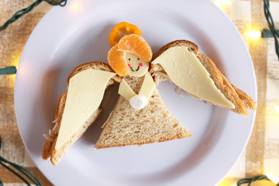 This Angel Sandwich Christmas lunch idea for kids is perfect for school lunch or lunch at home over winter break | shaped sandwich | angel shaped sandwich | angel food | angel crafts | fun food ideas | Christmas food #artscrackers #Christmasforkids #funlunchideas #lunchboxideas #creativefoodideas #pinterestmom #sandwiches #schoollunch #kidfriendlyfood #Christmasangel