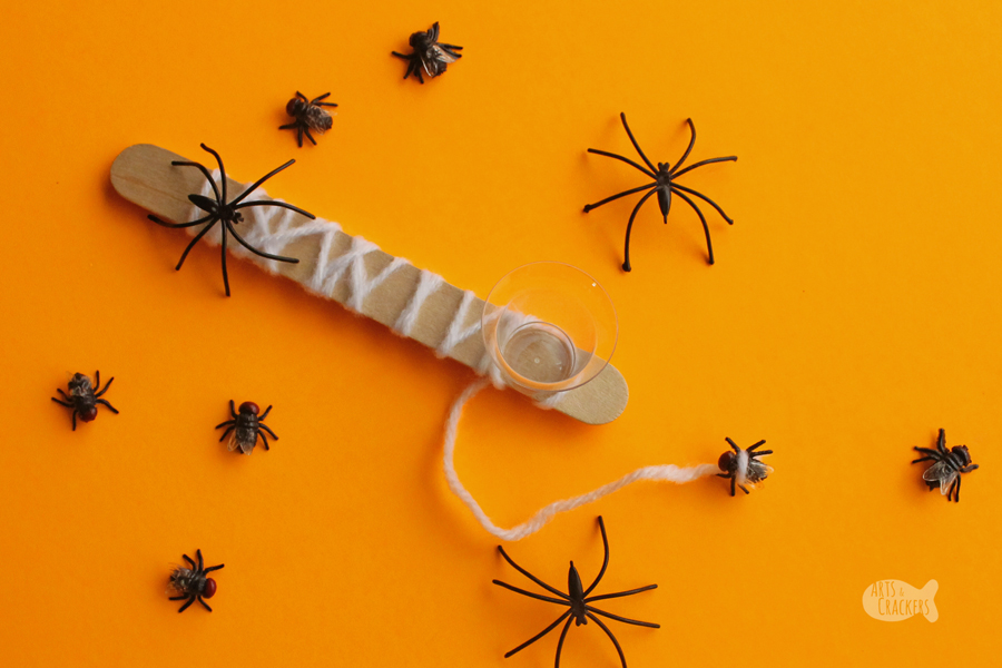 Make this fun cup-and-ball style Halloween Game, Spider Web Catch, as a Halloween activity or a non-candy treat for trick-or-treaters! #halloween #kidsactivities | Halloween Activity | Activities for Kids | DIY Crafts | Halloween Craft