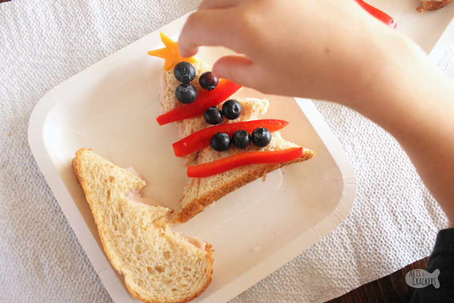 Celebrate Christmas with this fun, hands-on Christmas Tree Sandwich Lunch Idea for Kids | evergreen tree | pine tree | edible crafts | fun lunches for kids | Christmas tree food | Christmas lunch ideas | Christmas sandwich | sandwiches for kids | play with your food | lunchtime activity #momblogger #kidfriendlyfood #kidfood #foodblog #christmas