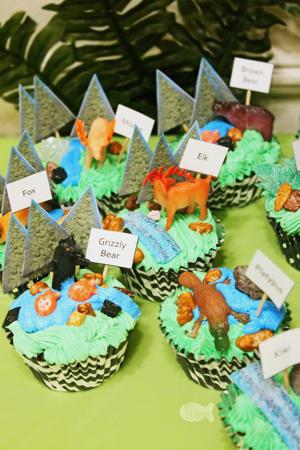 Decorate your own cupcakes with this zoo habitat themed cupcake bar | zoo party | zoo birthday | zoo cupcakes | zoo cake | safari cupcakes | DIY cupcakes | cupcake bar | zoo habitat activity | zoo activity | activities for kids | kids activity | kid birthday | birthday party activities | animal cupcakes | kid made food | kids in the kitchen | cupcakes for kids | kid cakes | #birthday #zoo #cupcakes #cakedecorating
