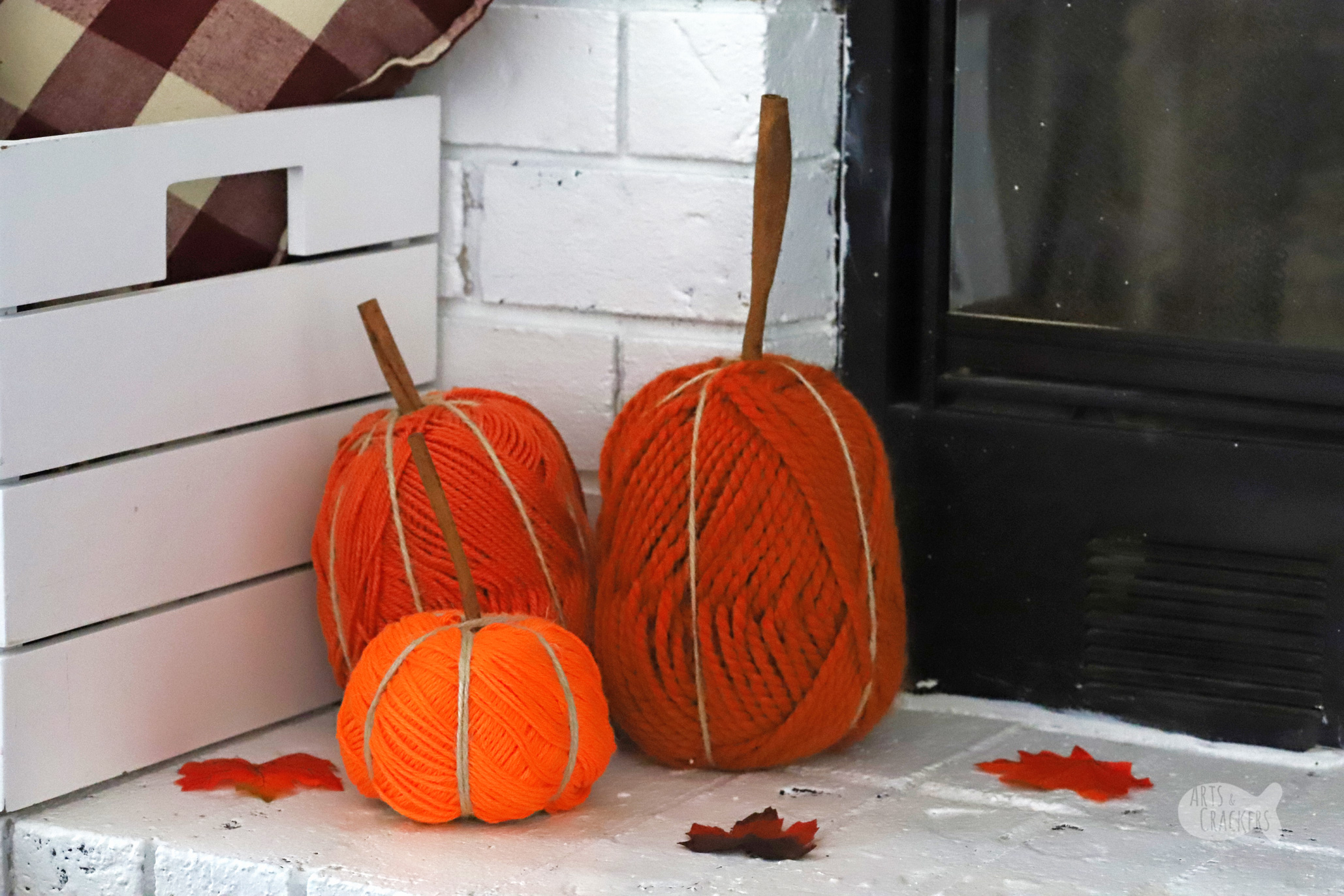 Decorate for fall with these adorable yarn pumpkins. Make this cute pumpkin decor with a yarn skein to make easy fall decorations for your home | DIY pumpkin decor | yarn skein crafts | fall crafts for the home | yarn pumpkins | no sew | yarn crafts for fall | fall home decorating | easy fall crafts | fall mantel | #yarncrafts #craftyfingers #autumncrafts #homedecor #pumpkins #yarn #DIYblogger